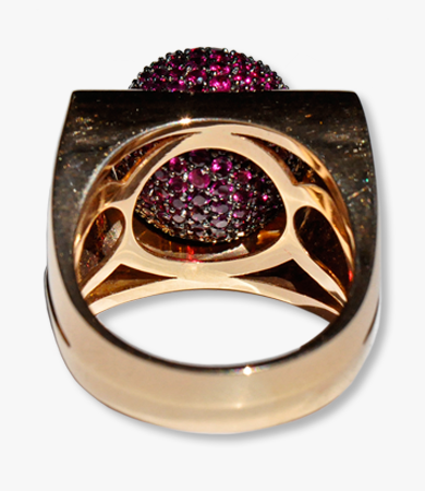 Rosé gold Enigma Bulgari ring with rotating ruby-set sphere | Statement Jewels